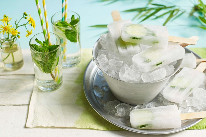 Gin & tonic ice lollies Ice lollies in a metal bowl filled with ice